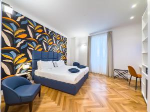A bed or beds in a room at Albergo Abruzzi