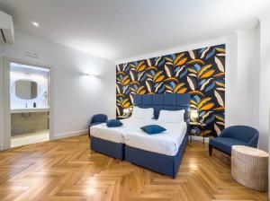 A bed or beds in a room at Albergo Abruzzi