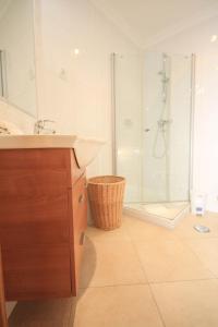 a bathroom with a sink and a shower at Apartamento Boavista Golf Resort by Algarving in Lagos +26 photos