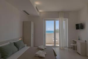 Una cama o camas en una habitación de B&B Mozzafiato