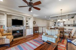 a living room with a television and a fireplace at CSC3M - Dawn Patrol in Kill Devil Hills