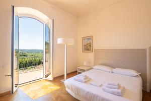 Ένα ή περισσότερα κρεβάτια σε δωμάτιο στο Chianti Relais Villa Ghibellina