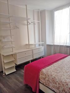 Ένα ή περισσότερα κρεβάτια σε δωμάτιο στο Central beautiful flat a pochi passi dal lago