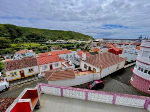 a view of a town with houses and a street at Nunes Praia in Praia da Vitória