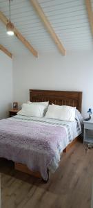 Ένα ή περισσότερα κρεβάτια σε δωμάτιο στο Casa Residencial Puerto Varas