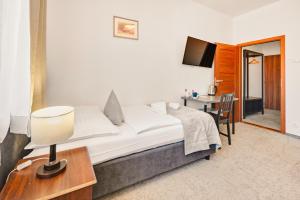Postel nebo postele na pokoji v ubytování 7Days B&B