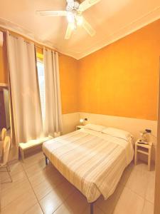 Postel nebo postele na pokoji v ubytování Guest House Hola Roma