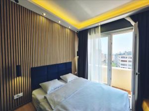 a bedroom with a large bed and a window at B&B View in Zagreb