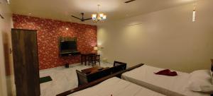 Postel nebo postele na pokoji v ubytování peacevillageresort