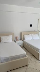 Postel nebo postele na pokoji v ubytování Orea Hotel