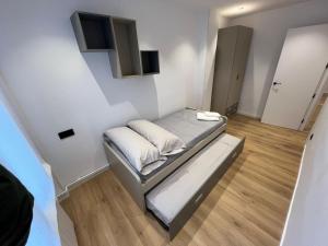 a small bedroom with a bed in a room at Plaza de España Burgos in Burgos