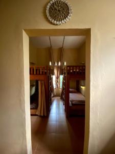 a room with two bunk beds and a hallway at Social Ducks Hostel Borobudur in Borobudur +11 photos