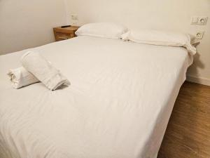 Postel nebo postele na pokoji v ubytování Apartamentos La Solana Deluxe 3000