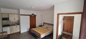 Kuchyň nebo kuchyňský kout v ubytování Apartmány Bardi + 11 fotografií