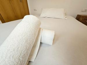 Postel nebo postele na pokoji v ubytování Apartamentos La Solana Deluxe 3000