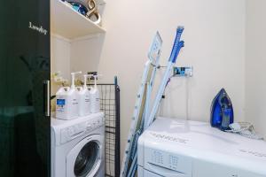 a laundry room with a washer and a washing machine at Rossendale Incredible Home 3Bedrooms Driveway Sleeps 6 in Newchurch +137 photos