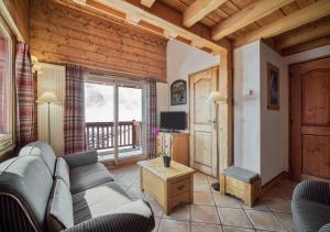 Televízia a/alebo spoločenská miestnosť v ubytovaní Appartement Ecrin 324