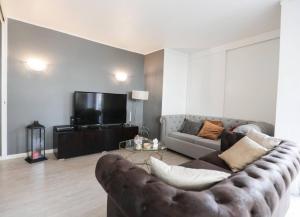 TV a/nebo společenská místnost v ubytování Lisbon South Beach Apartment