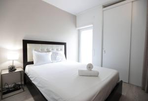 Postel nebo postele na pokoji v ubytování Lisbon South Beach Apartment