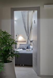 Postel nebo postele na pokoji v ubytování B&B Radici