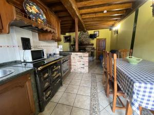 Kuchyň nebo kuchyňský kout v ubytování La Corrada