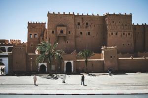 people standing in front of a large building at Desert Soul Camp in Erfoud