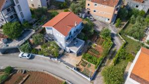 an overhead view of a house with an orange roof at Apartment Ban in Šibenik