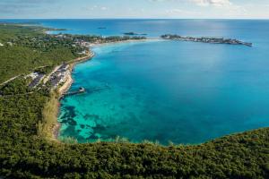 an aerial view of a island in the ocean at French Leave Resort, Autograph Collection in Governorʼs Harbour