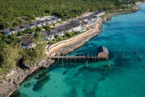 an aerial view of a resort on an island in the water at French Leave Resort, Autograph Collection in Governorʼs Harbour