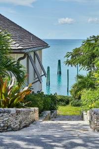 a house with a view of the ocean at French Leave Resort, Autograph Collection in Governorʼs Harbour