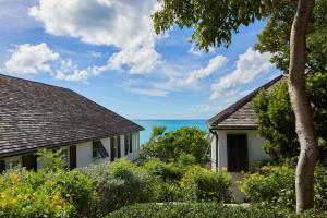 a house with a view of the ocean at French Leave Resort, Autograph Collection in Governorʼs Harbour
