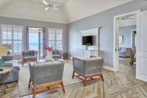 a living room with a couch and chairs at French Leave Resort, Autograph Collection in Governorʼs Harbour