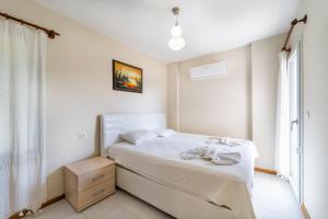 Ένα ή περισσότερα κρεβάτια σε δωμάτιο στο Villa LİMON - Göcek