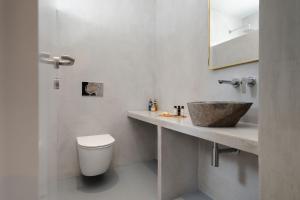 a bathroom with a sink and a toilet at Villa Solena, Brand-New with Pool, Agia Anna Naxos in Glinado Naxos +28 photos