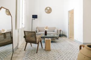 a living room with a couch and a table at Palais Gentile Matino in Matino