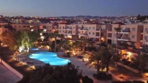 an aerial view of a resort with a swimming pool at H&O Sea & Sun Apartment in Paphos City +66 photos