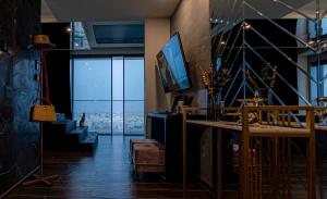 a living room with a view of a city at 2401 at Mercury by AURA in St. Julianʼs +12 photos