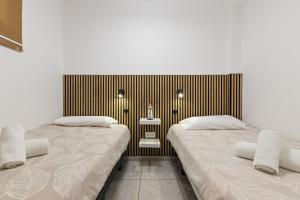 Postel nebo postele na pokoji v ubytování Sol Montemar 10 by IVI Real Estate + 12 fotografií