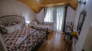 Postel nebo postele na pokoji v ubytování Cabana Csiki + 21 fotografií