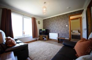 Μια τηλεόραση ή/και κέντρο ψυχαγωγίας στο Gairloch View Holiday Cottages