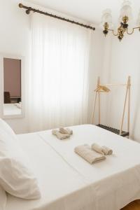 Postel nebo postele na pokoji v ubytování Torres Rooms Sassari