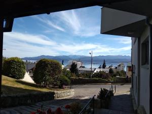a view of the ocean from a house at Amado Sur Apartment in San Carlos de Bariloche