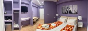 A bed or beds in a room at CALYPSO