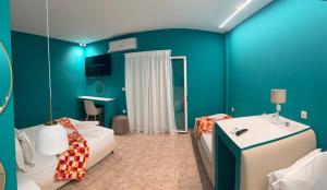 A bed or beds in a room at CALYPSO