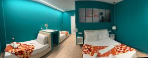 A bed or beds in a room at CALYPSO
