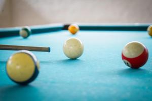 a group of pool balls on a pool table at Hotel Hacienda Rincon del Cielo in Curití