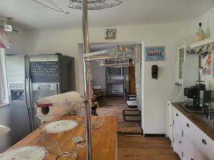 a kitchen with a table and a dining room at Ambergers exklusive Ferienwohnungen in Maar