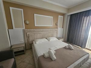 Postel nebo postele na pokoji v ubytování Hotel Pini