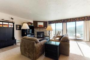 a living room with two couches and a television at Buffalo Ridge 205 in Silverthorne