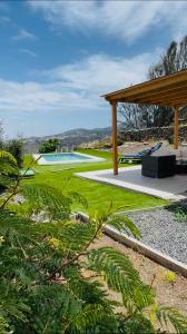 a view of a golf course with a pavilion at Villa Alegría Gran Canaria Piscina Climatizada in Las Palmas de Gran Canaria